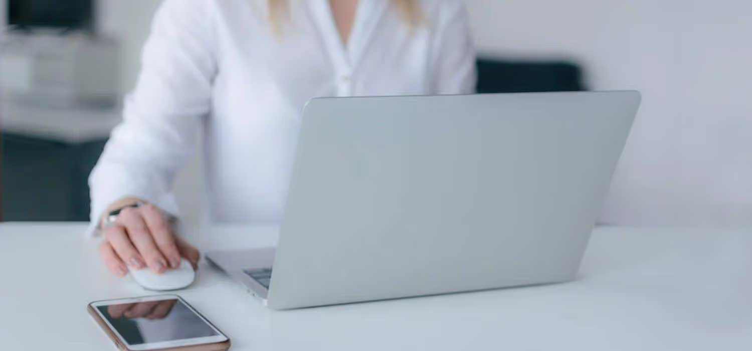 Woman faces laptop while using a project management software