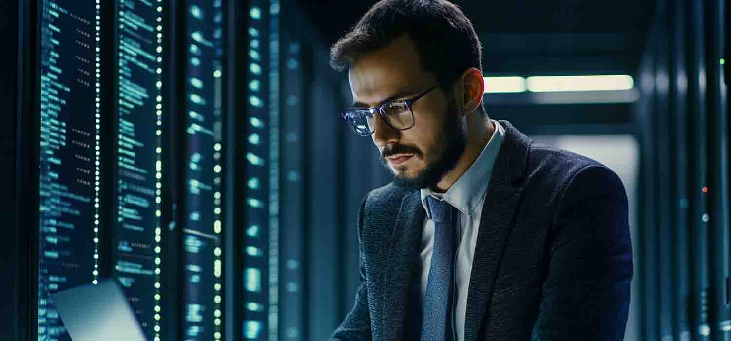 Business owner reviewing a scalable data security management dashboard on a laptop